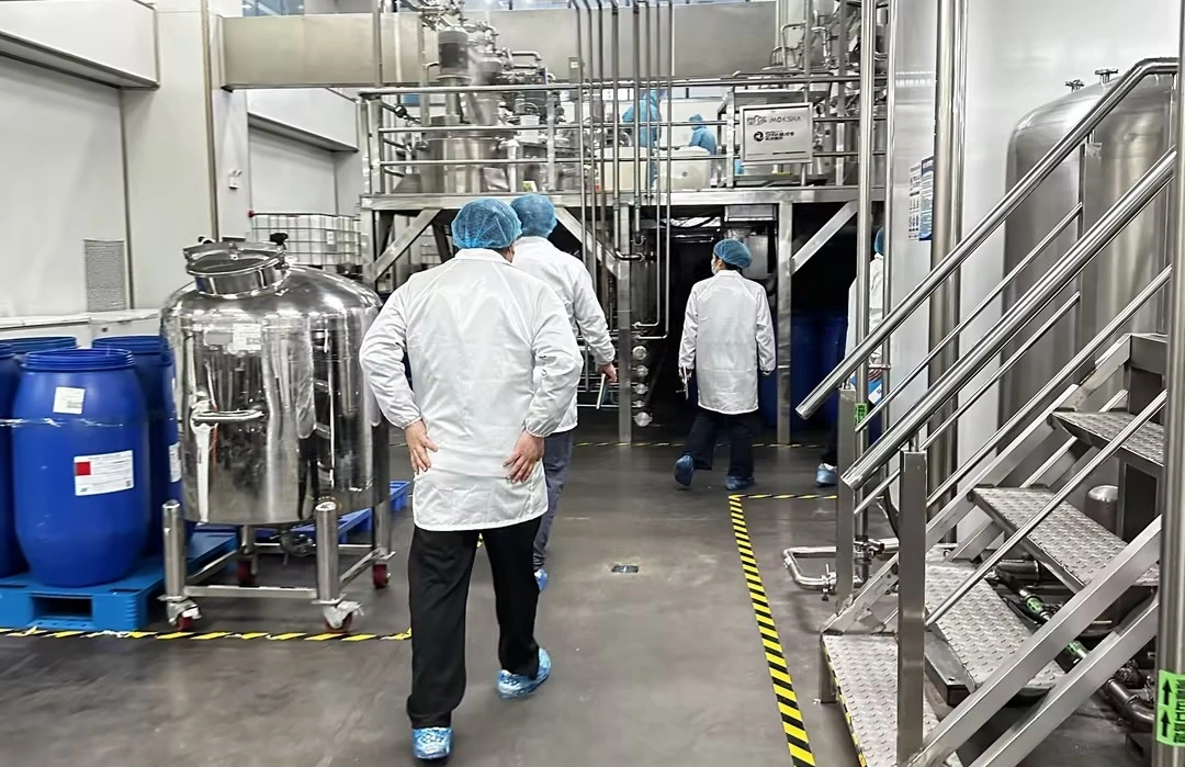 Factory Entrance & Audit Team Entering the Facility Factory Entrance & Audit Team Entering the Facility