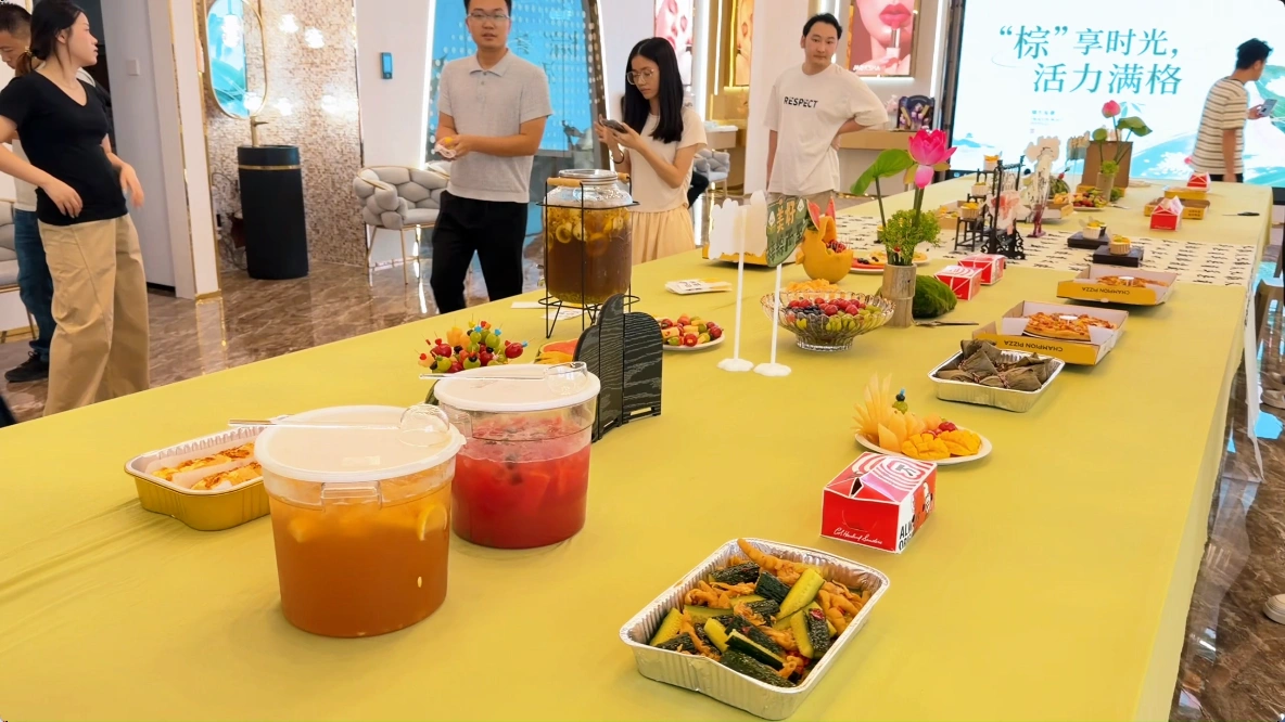 Moksha employees sharing food and drinks during team-building activity Moksha employees sharing food and drinks during team-building activity
